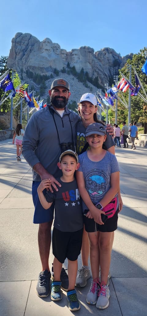 Josh Saleh with his wife Sara and their two children at Mount Rushmore